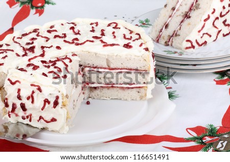 Sliced white layer cake on a platter