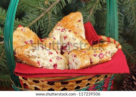 Closeup of cranberry and nut scones in a Christmas basket