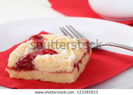 Closeup of a cherry bar on a red napkin