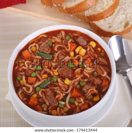 Bowl of vegetable beef and noodle soup