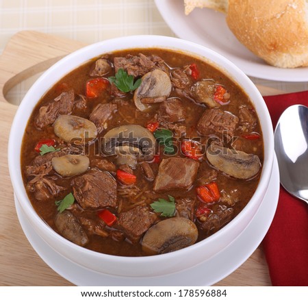 Bowl of soup with beef, mushrooms and peppers