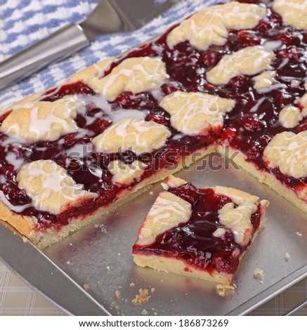 Cherry fruit bars on a baking sheet