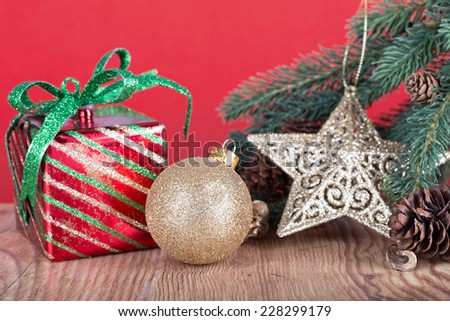 Christmas decoration on a wood floor with a red background