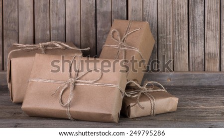 Assortment of brown packages on a wood background