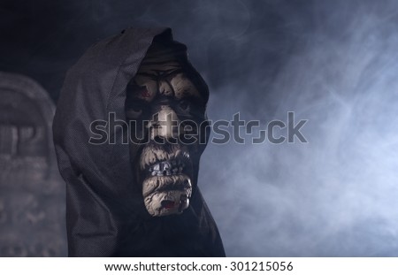 Scary halloween zombie prop on a smoky background