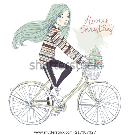 girl on a bicycle with a Christmas tree girl on a bicycle with a Christmas tree