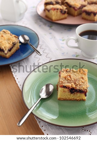 Slices of cake with jam arranged on a plate