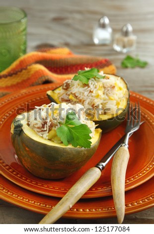 Baked acorn squash with rice and chicken stuffing ready to serve