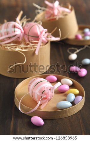 Easter eggs and sugar coated candy eggs in the gift paper box