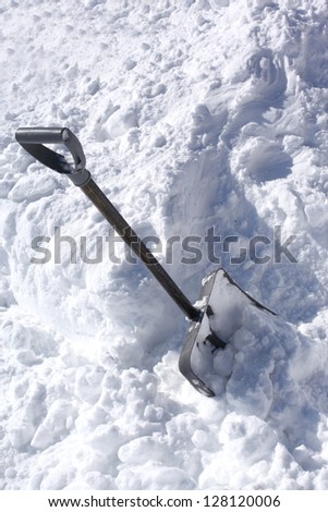 Snow shovel in a deep snow