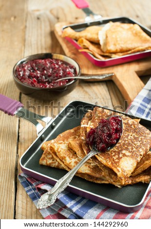 Crepes with black currant jam