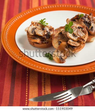 Fried mushrooms on toasted bread