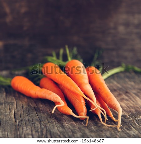 Fresh Organic Carrots On Wooden Background
