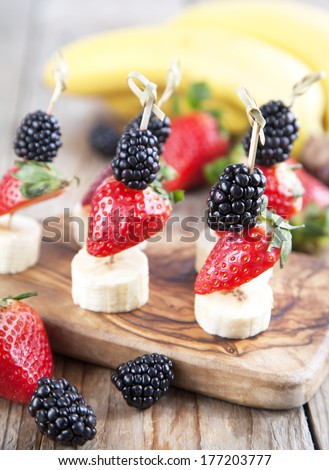 Fresh fruits on the skewers. Shallow depth of field