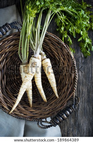 Fresh parsley root in basket