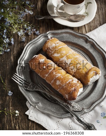 Deep-fried pastry filled with cream. Toned image
