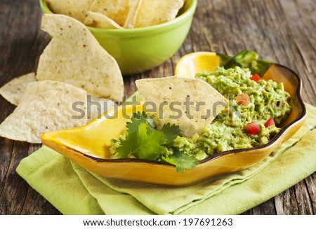 Fresh guacamole with corn tortilla chips.