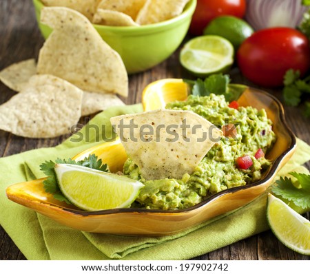 Fresh guacamole with corn tortilla chips.