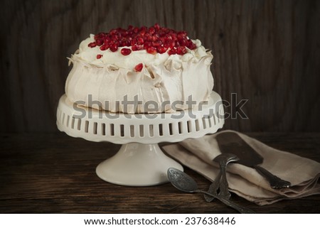Pavlova cake with pomegranate. Meringue cake with pomegranate