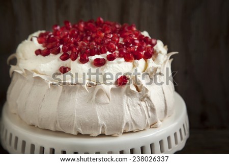 Pavlova cake with pomegranate. Meringue cake with pomegranate