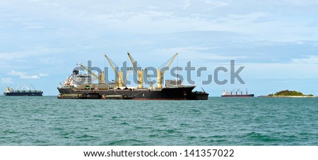 Vessel bulk cargo with crane in the ocean