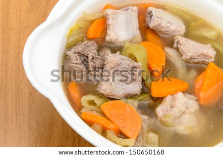 Pickled cabbage soup with carrots and pork ribs
