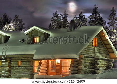 Wooden cottage in the winter\'s evening. Finland.
