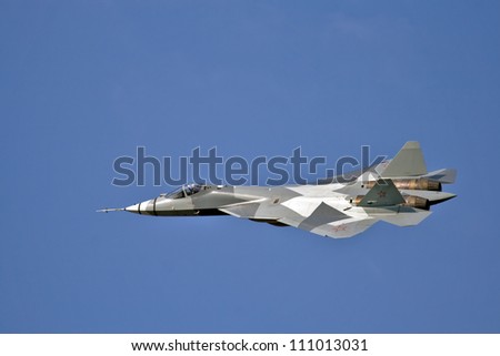 ZHUKOVSKY - AUGUST 12: New Russian five generation's fighter T-50 shows demonstration flight at show dedicated to the centenary of the Russian Air Force August 12, 2012 in Zhukovsky, Russia.
