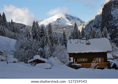 Wooden cottage in the winter mountains. France