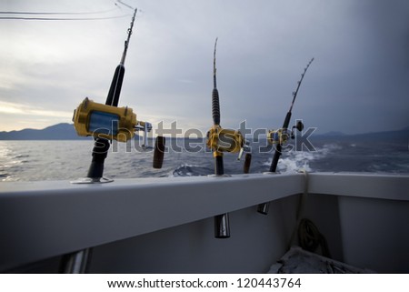 Fishing gears and fisherman boat sailing away in open sea