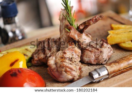 Beef steak barbecue with fried potato and red wine on wood table