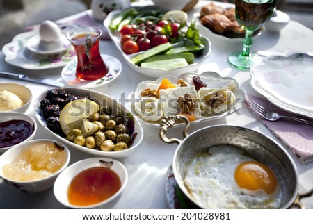 Rich and delicious Turkish breakfast on a round table