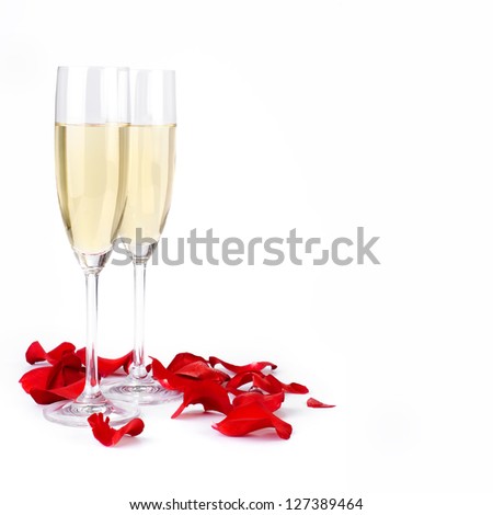 Rose petals and champagne on a white background with clipping path