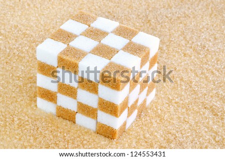 Cube of brown and white sugar cubes