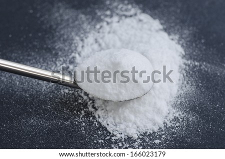 Sodium bicarbonate in a spoon