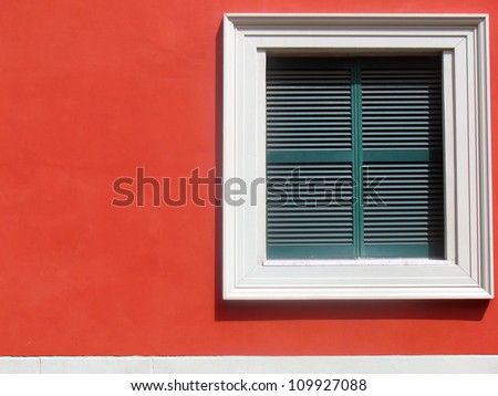 Square window in a red wall