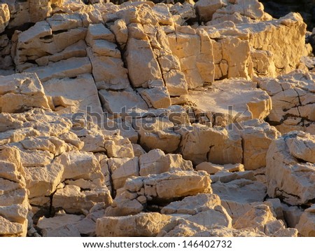 Rocks and stones in the sunlight,  stone by stone