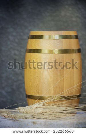 Old oak barrel on a wooden table