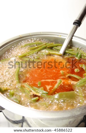 Vegetable soup with green beans,cooking on the stove