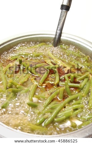 Vegetable soup with green beans,cooking on the stove