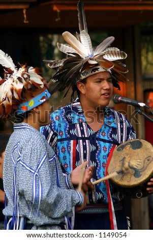 American Indians play music for the dancers An American Indian performs at a local fair