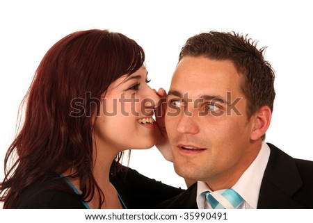 Beautiful brunette woman whispering into her boyfriends ear