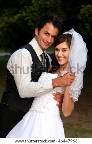 stock photo Beautiful wedding couple dancing on the lawn at their