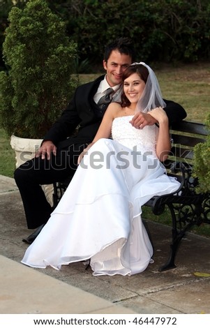 stock photo Beautiful smiling young wedding couple sitting together at 