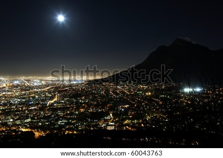 Cape Town city at night with moon in the sky