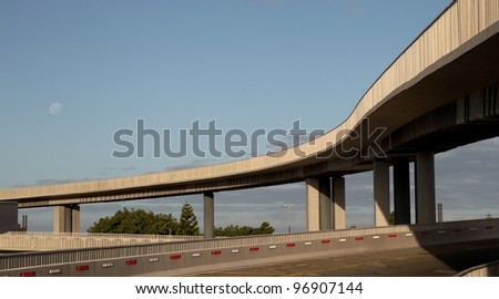 Modern overhead concrete highway road suspended on concrete columns