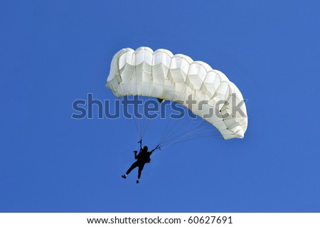 White parachute on blue sky