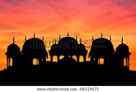 Silhouette of rich palace and temple at sunset, Shekhawati, Rajasthan, India.