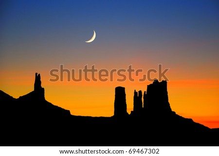 Silhouette of giant rocks at dusk, Monument Valley, USA.