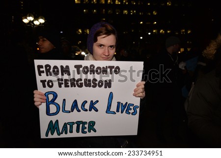 TORONTO, ONTARIO/CANADA - 25th Tuesday November  2014 : Toronto's Black Community takes action in solidarity with Ferguson protesters in Toronto, Canada.